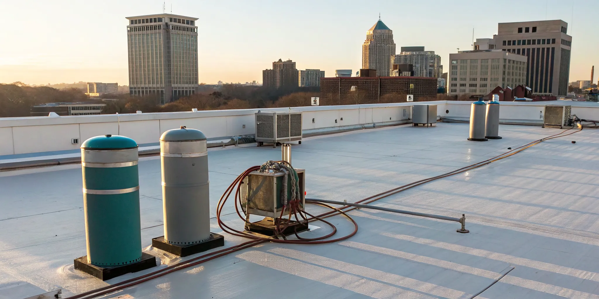 Commercial HVAC units on a Greensboro rooftop using synthetic refrigerants.