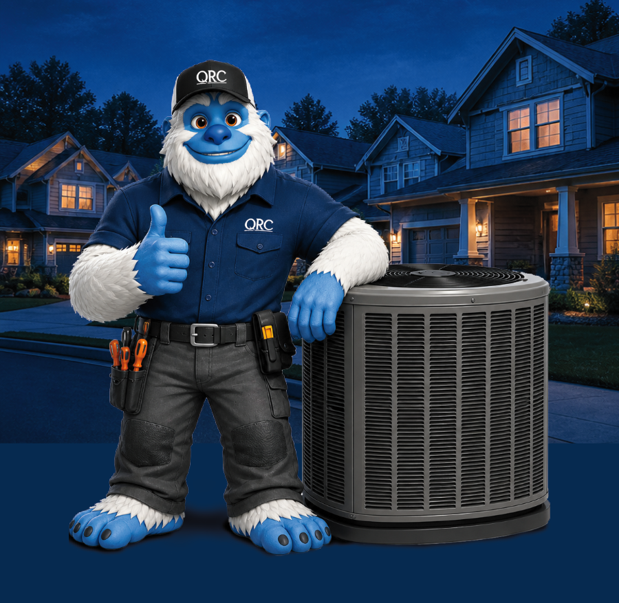 A blue yeti mascot in a work uniform and cap stands next to a large outdoor HVAC unit in front of suburban houses at dusk, giving a thumbs-up.